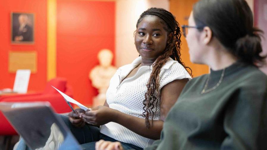 Two students sitting